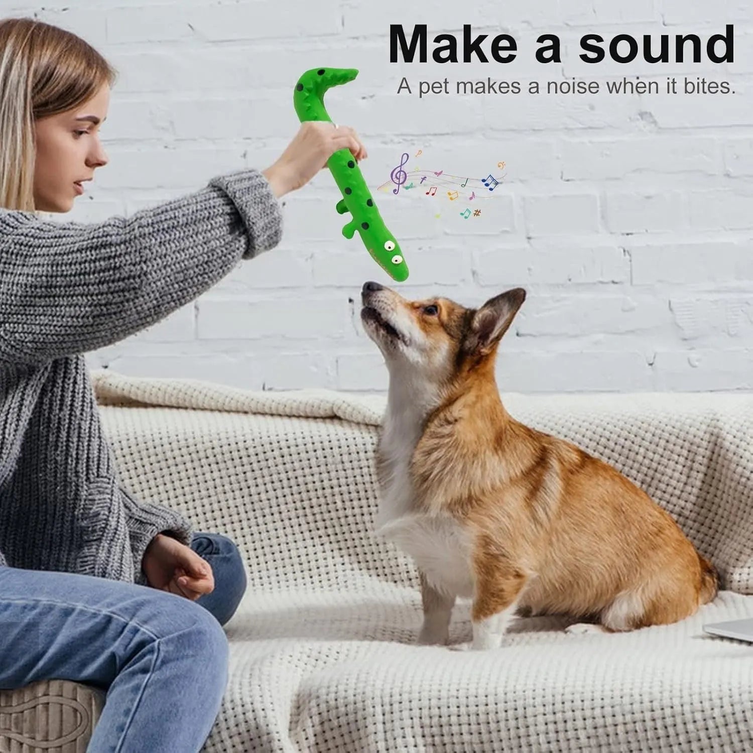 Green lizard-shaped dog chew toy with textured surface and squeaker, measuring 24cm long