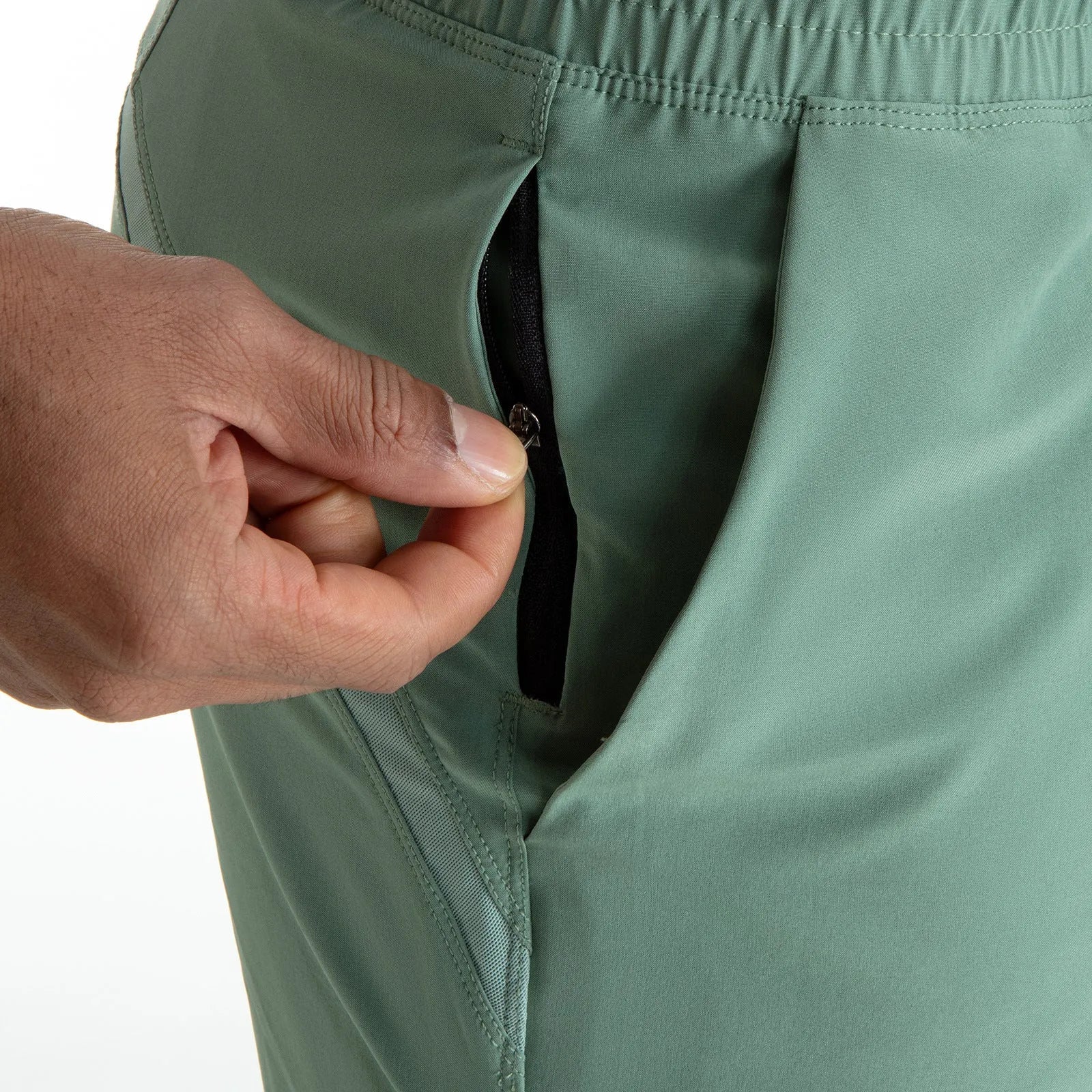 Man wearing black quick-dry polyester sports shorts suitable for running or gym workouts.