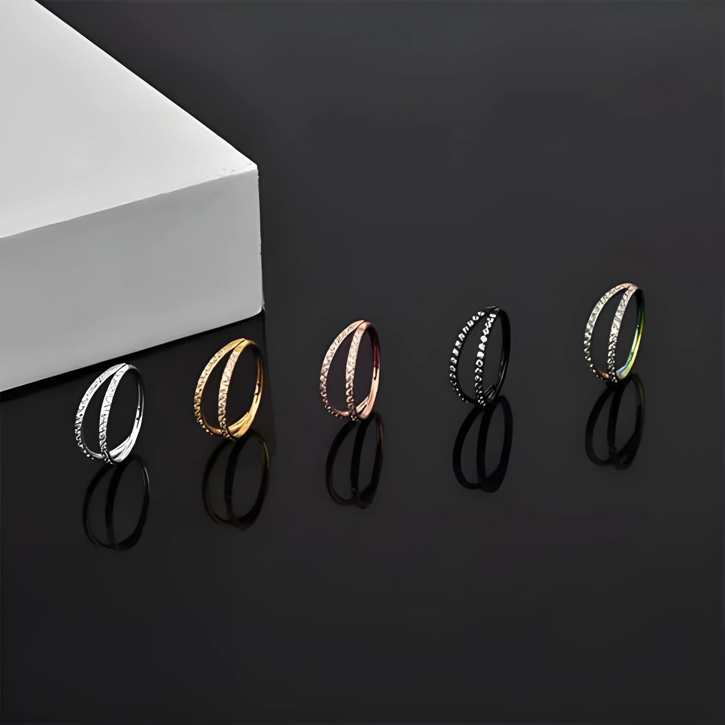 G23 titanium alloy nose ring with diamond-treated surface in gold or steel colour, showing precise gauge measurements
