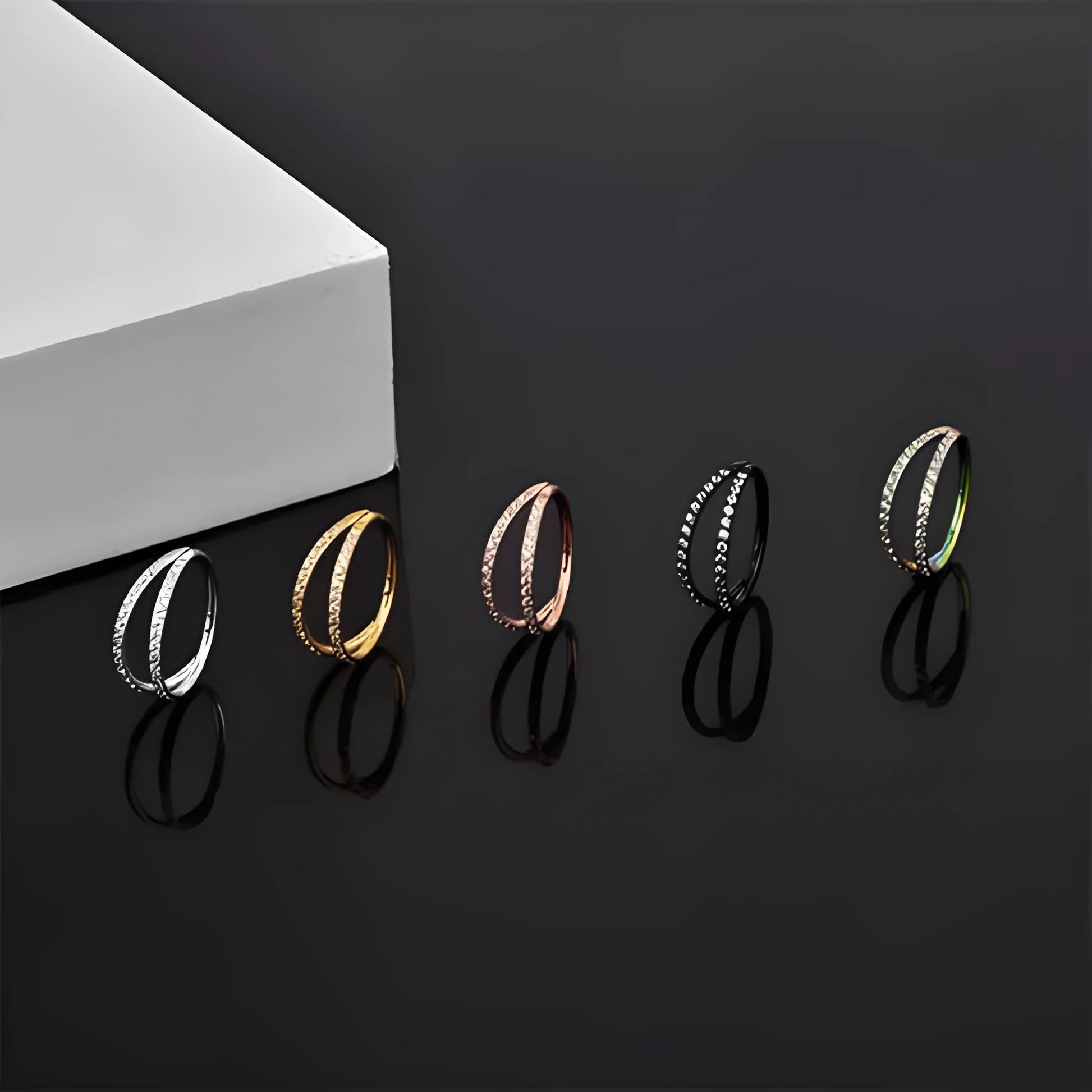 G23 titanium alloy nose ring with diamond-treated surface in gold or steel colour, showing precise gauge measurements