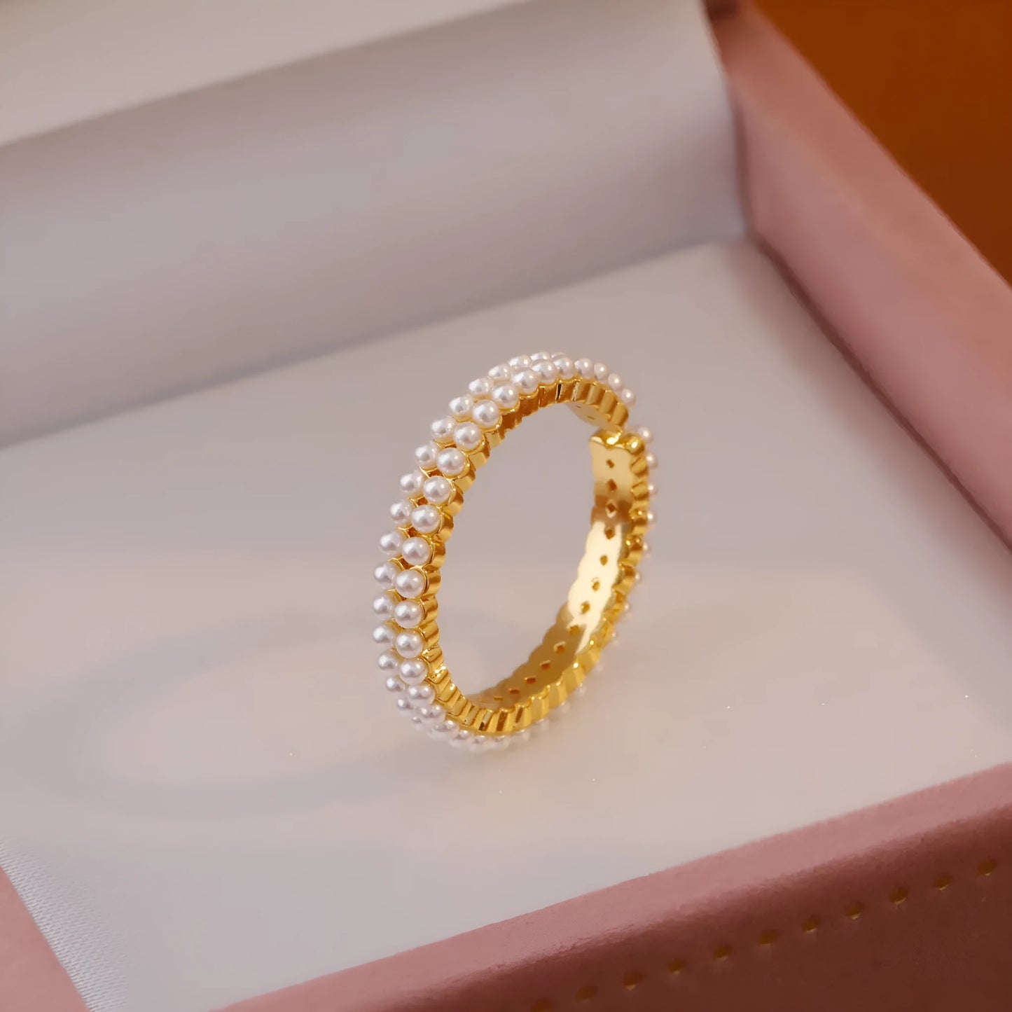 Gold electroplated pearl ring with open mouth geometric design and round pearl elements