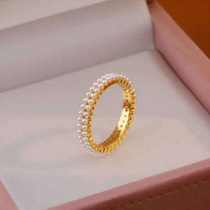 Gold electroplated pearl ring with open mouth geometric design and round pearl elements