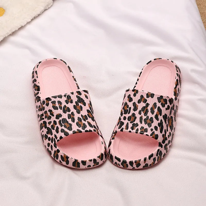 Women's leopard print slippers with a thick EVA sole in multiple colour options on a white background.