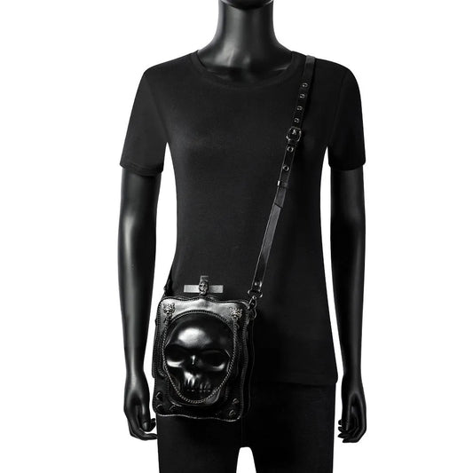 Black mini square messenger bag with embossed skull design, metal chains, and crossbody strap