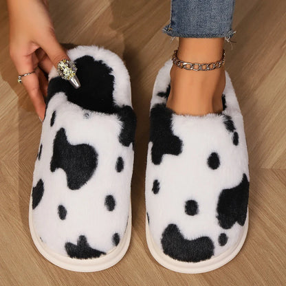 Cozy plush cow-print slippers with non-slip soles for comfortable indoor wear