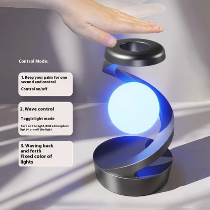 A rotating moon-shaped desk lamp with a wireless charging pad for smartphones, featuring a sleek and modern design.