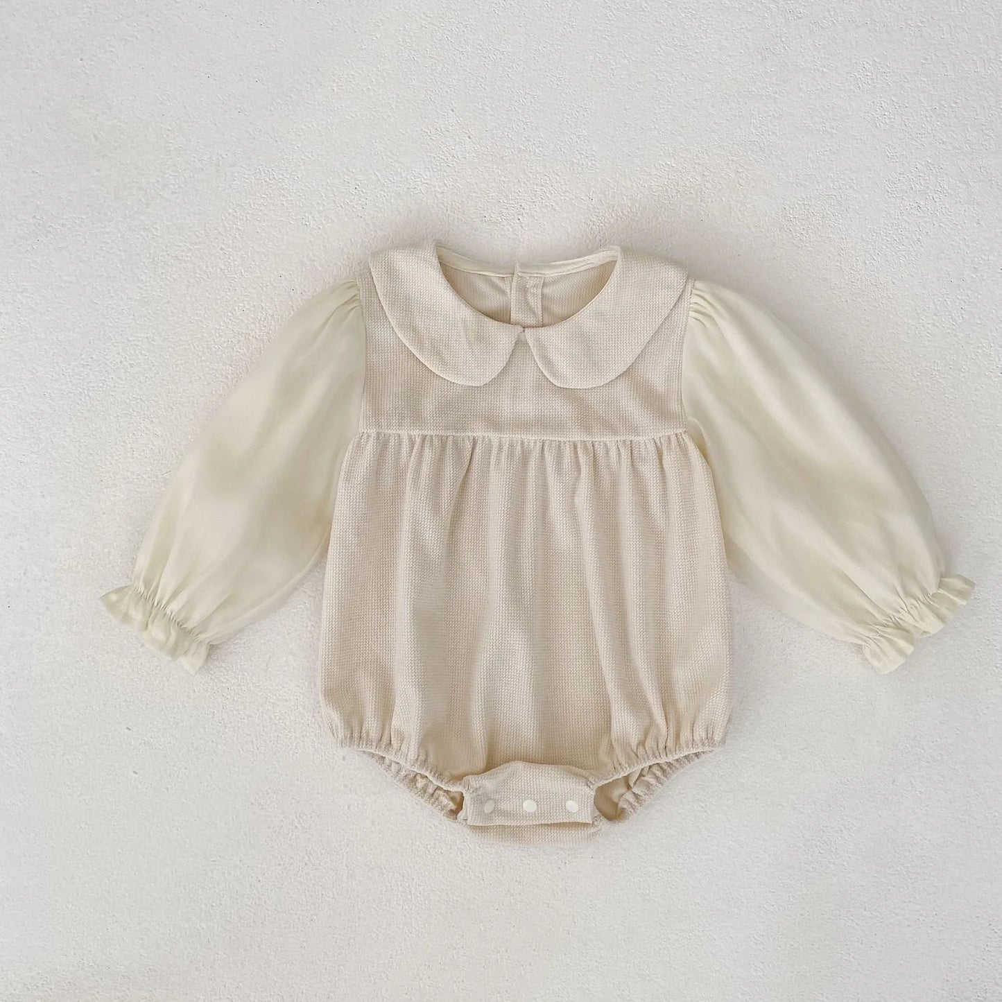 Corduroy doll collar long sleeve baby romper in black or apricot with single-breasted closure