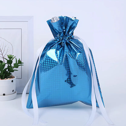Christmas gift bag with drawstring closure in laser gold finish, 32x24cm dimensions
