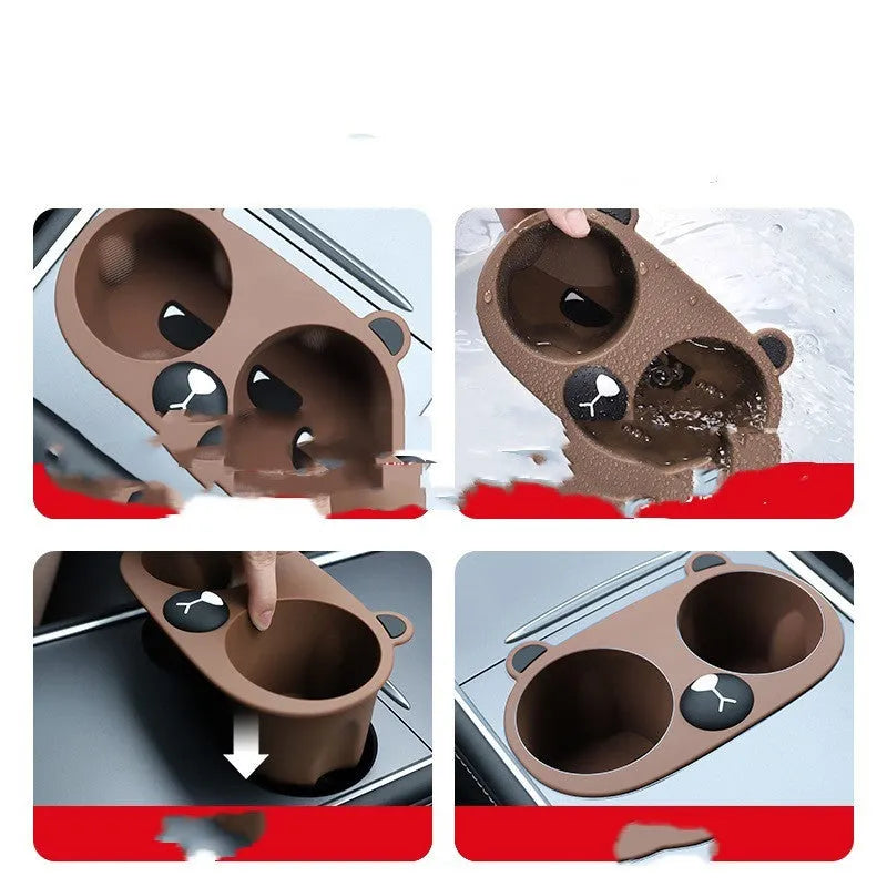 Flexible grey silicone car cup holder insert with a raised cartoon animal design for the centre console.