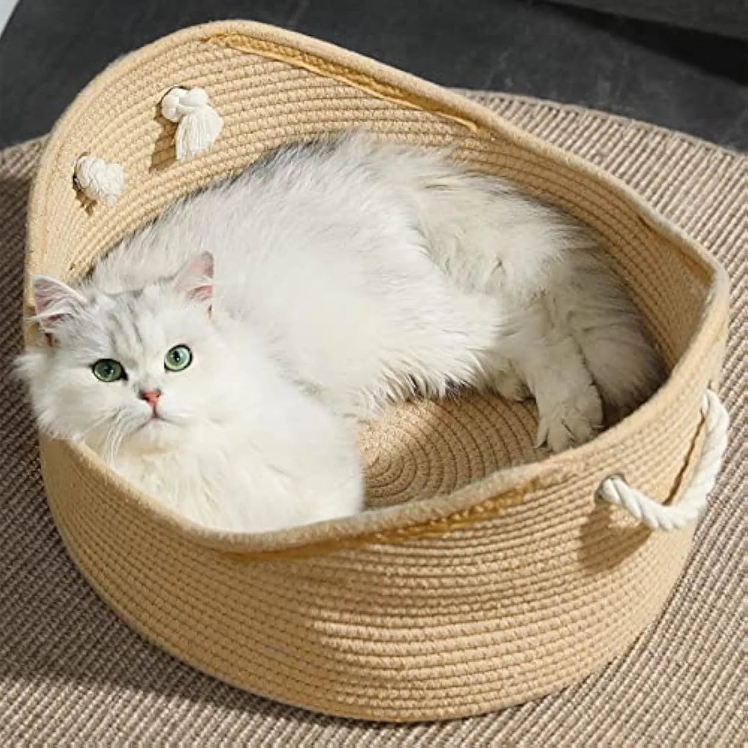 Natural wicker cat basket with integrated corrugated cardboard scratching panel side.