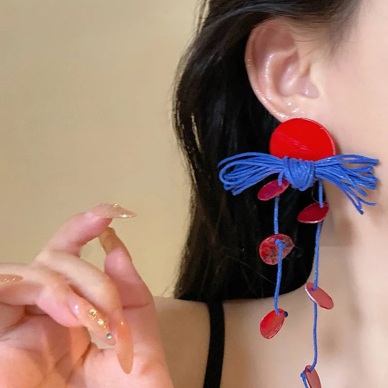 Geometric blue cloth women's earrings with round elements and a handcrafted finish.