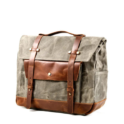 Camel Bag Knight retro cotton messenger bag in army green, showing front flap, rivet details, and size next to a motorcycle helmet.