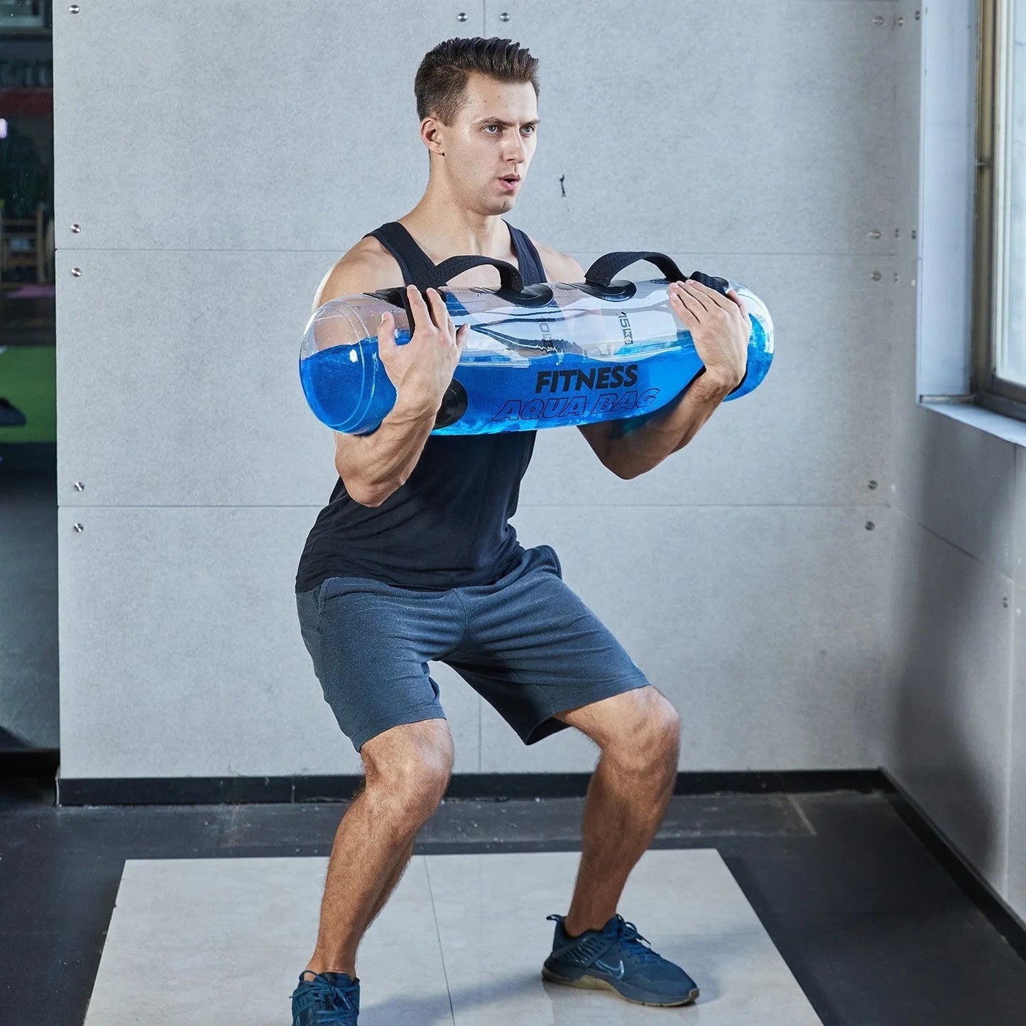 Transparent PVC inflatable water bag dumbbell for adjustable weight training.