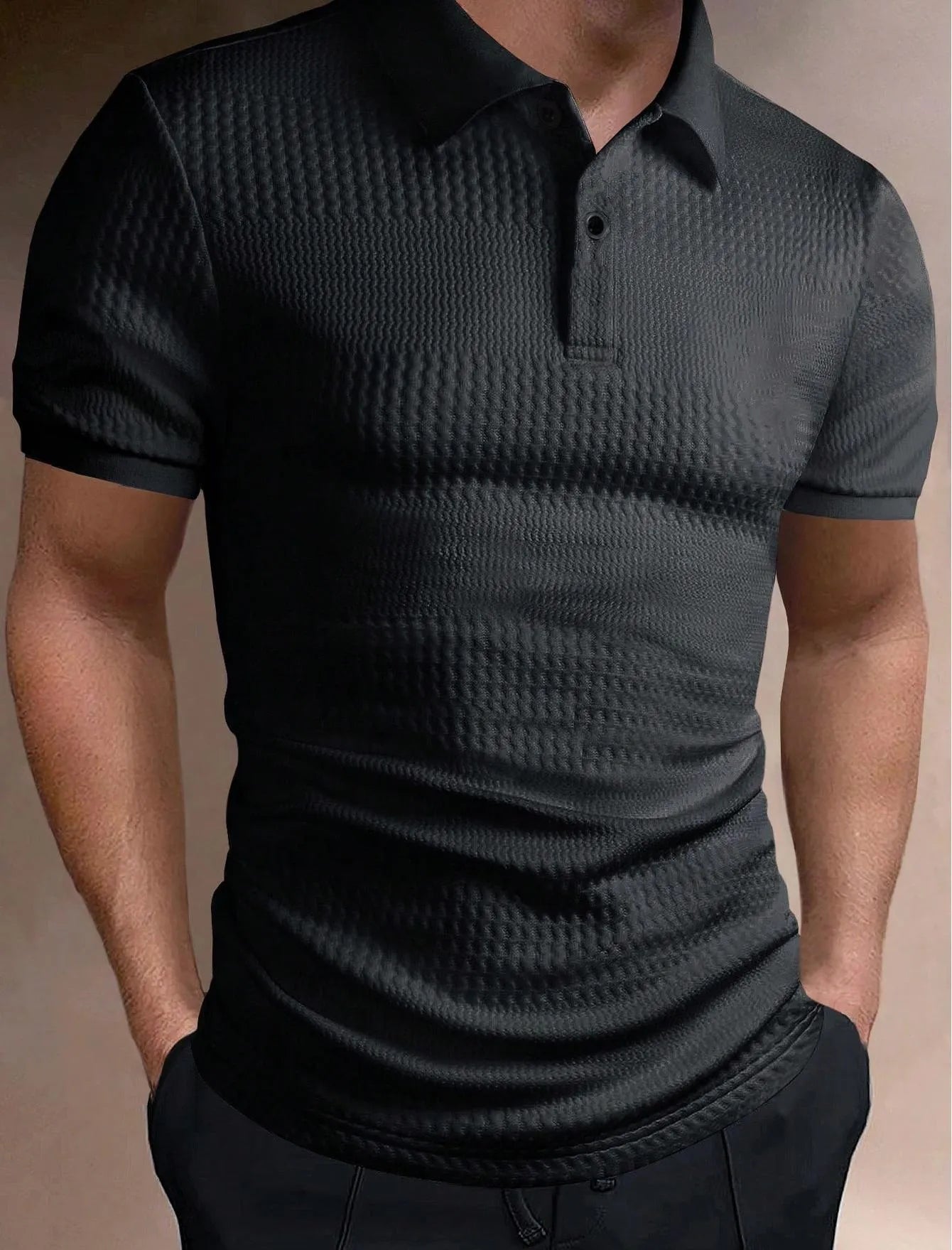 Man wearing a striped loose-fit polo shirt in light blue, showing short sleeves and asymmetric detail.