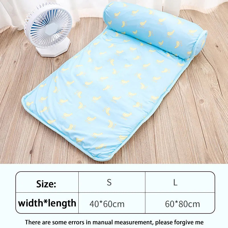 Pink blue green dog cooling mat on floor with pet, showing medium and large size options