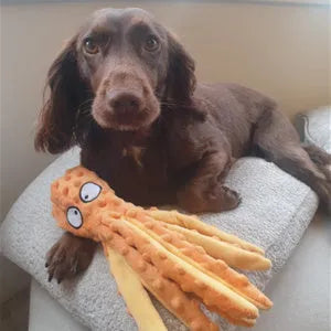 Blue octopus plush dog toy with tentacles, unfilled design with crinkle paper and squeaker sounds
