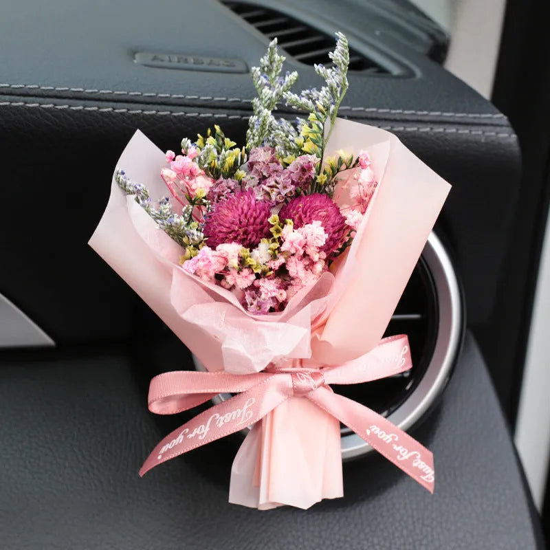 Mini dried flower bouquet mounted in car air vent for decorative aromatherapy