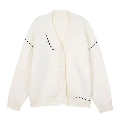 Women's knitted cardigan top coat in black or white, loose fit with long sleeves, made from 100% polyester