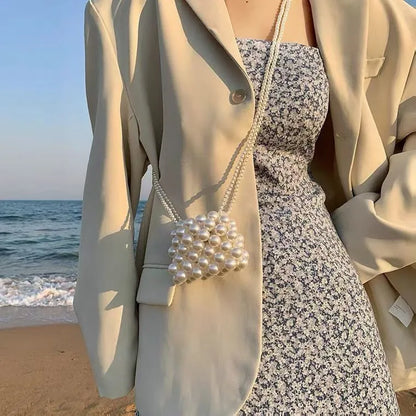 Women's imitation pearl mini crossbody handbag with geometric pattern in a pearl colour.