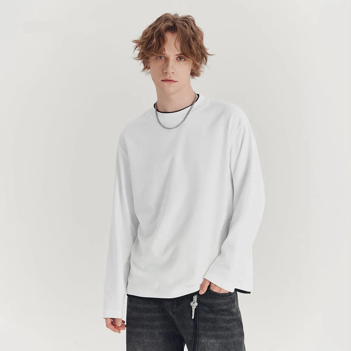 Men's loose fit long-sleeved cotton blend t-shirt in solid colour on hanger