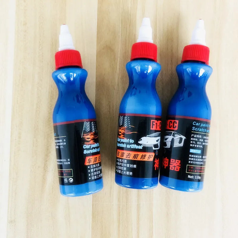 Blue car scratch repair agent container with microfiber cloth for minor automotive surface imperfections