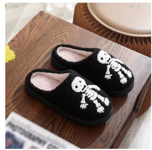 Halloween-themed indoor house shoes with spider ghost design, non-slip sole, and plush lining