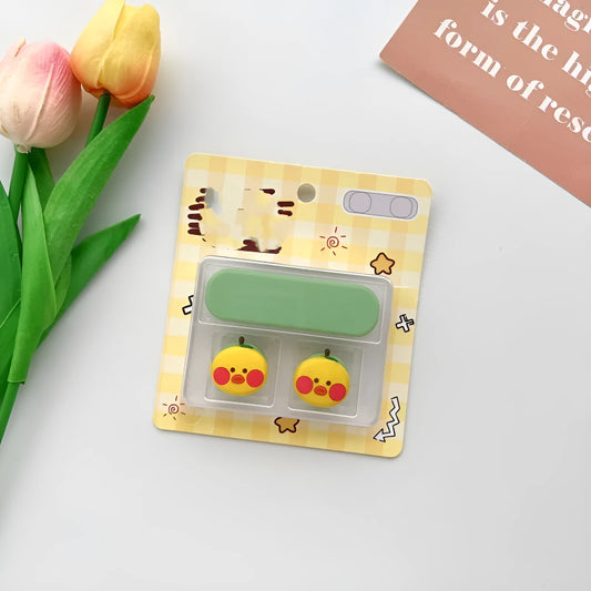 Colourful cartoon magnetic USB-C data cable fixer for desktop hubs on a desk.