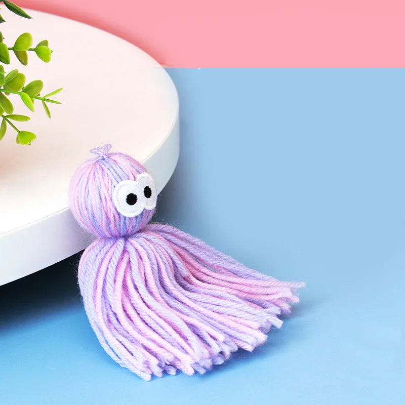 Bite-resistant wool ball cat toy with hanging cord in blue grey colour