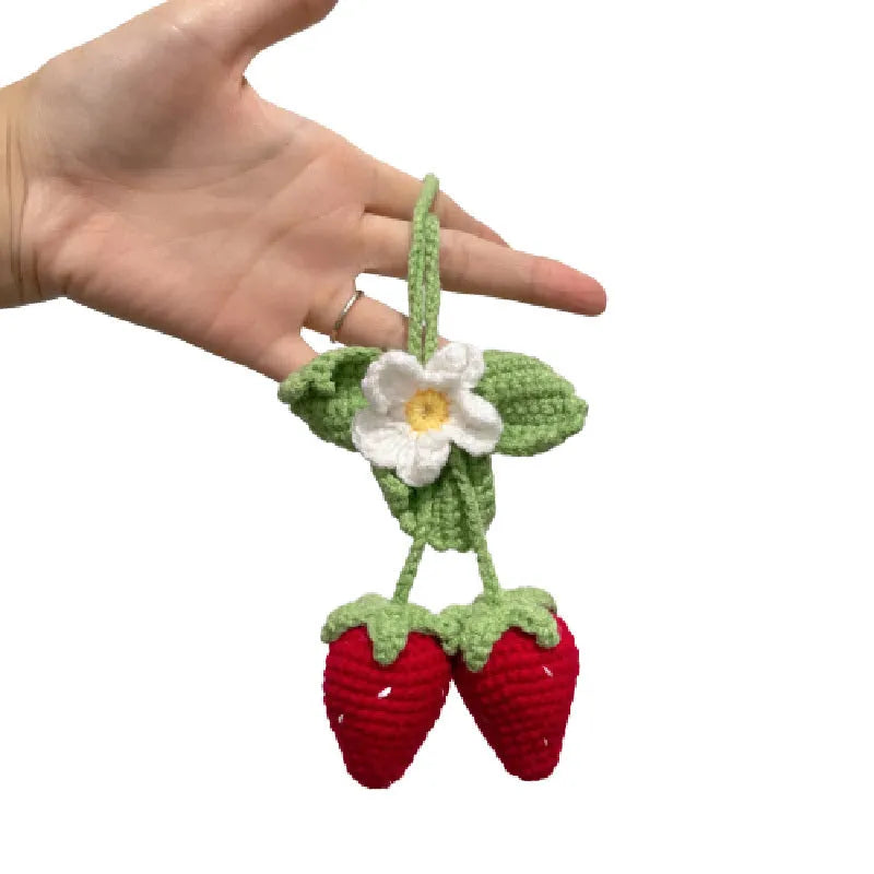 Handmade strawberry-shaped car pendant woven from cotton and hemp fibres, approximately 10-12cm long