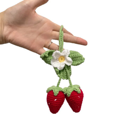 Handmade strawberry-shaped car pendant woven from cotton and hemp fibres, approximately 10-12cm long