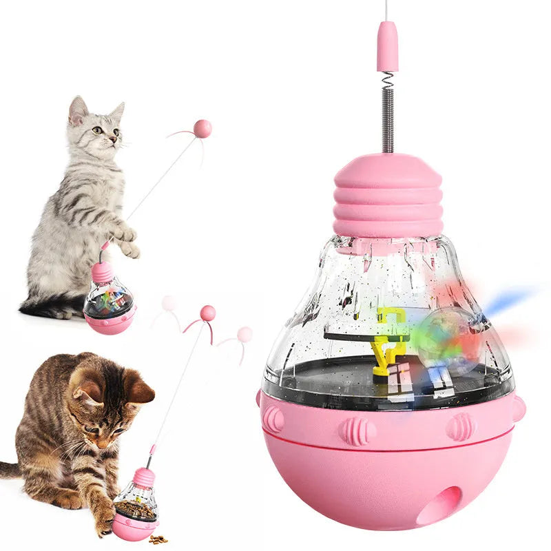 Multi-functional cat toy with tilting base, teaser wand with ball and ribbon, and food dispenser opening