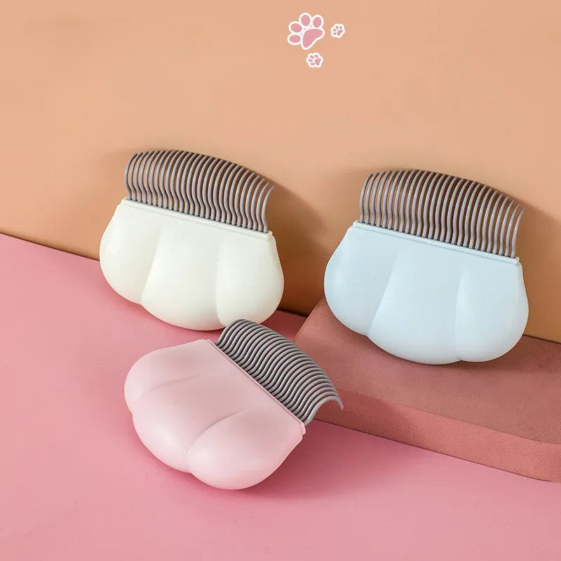 Blue Paw Soft deshedding brush for removing matted fur from cats and dogs on a white background.