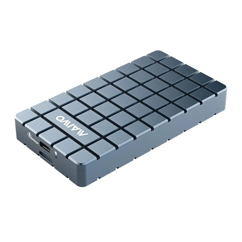 Silver aluminium alloy USB4 hard disk enclosure for M.2 SSDs, shown next to a laptop.
