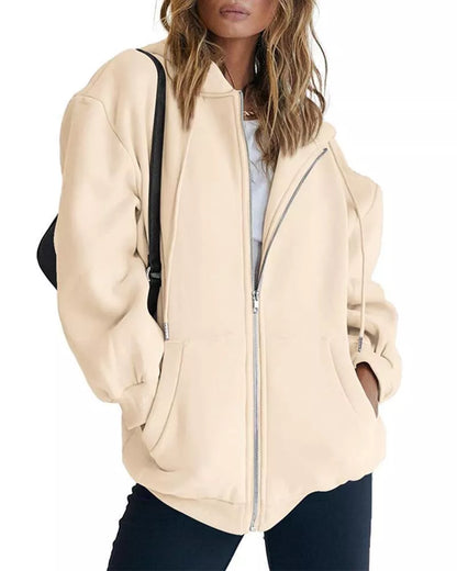 Women's solid color zipper hooded sweatshirt with drawstring, available in multiple colors and sizes.