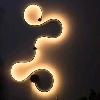 Modern black and white LED wall lamp with aluminium shade in four different sizes for bedside or corridor lighting