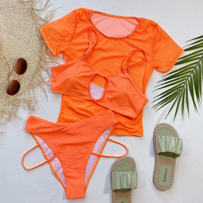 Orange high-waist ladies bikini three-piece set on a beach backdrop