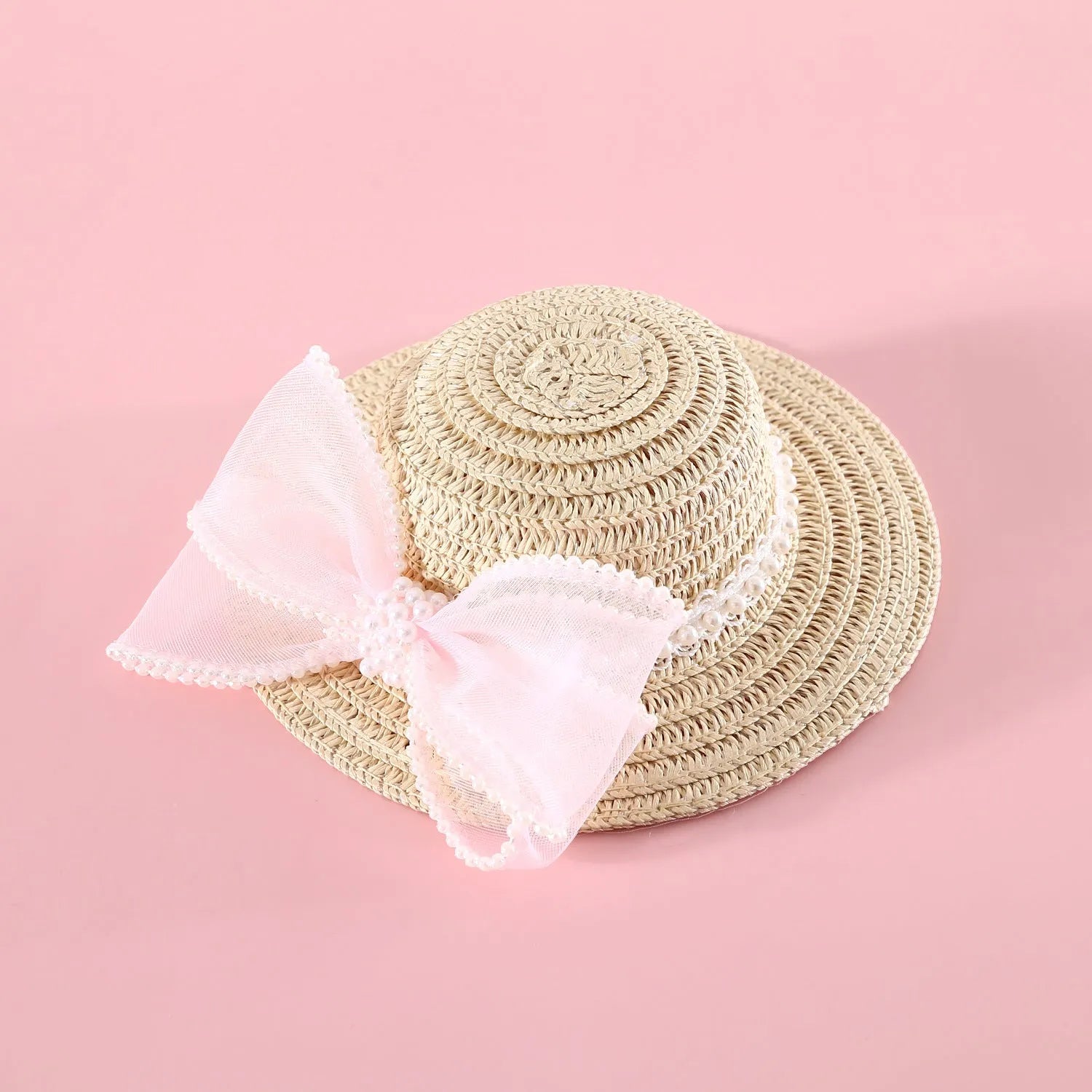 A woven Lafite leaf hat for cats with a pearl butterfly bow, shown in pink, purple, blue, and white colour options.