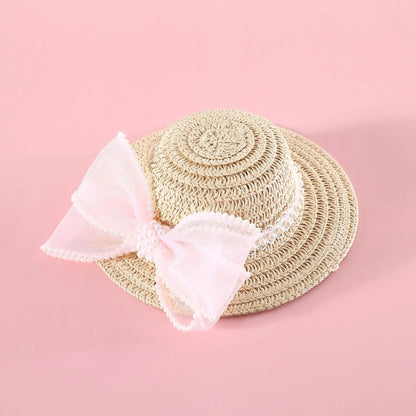 A woven Lafite leaf hat for cats with a pearl butterfly bow, shown in pink, purple, blue, and white colour options.