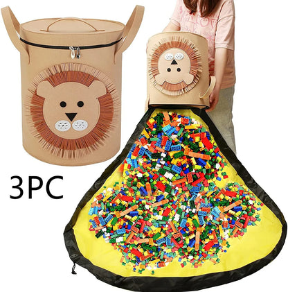 Green felt storage cube with pull rope unfolded into a large square play mat on a wooden floor.
