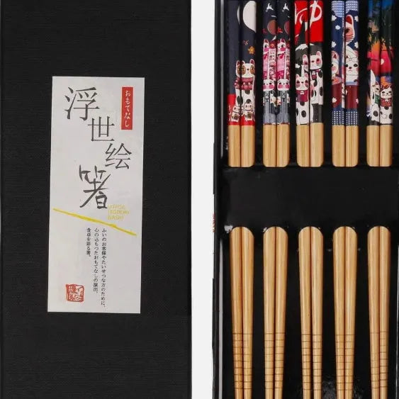 Set of five pairs of bamboo chopsticks showing lucky cat and chi ya blue pattern designs in gift box.