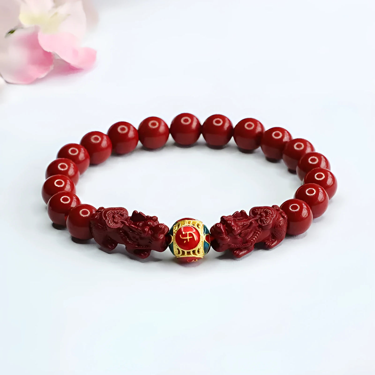 Purple gold sand cinnabar bracelet with carved double Pixiu design, 8mm beads.