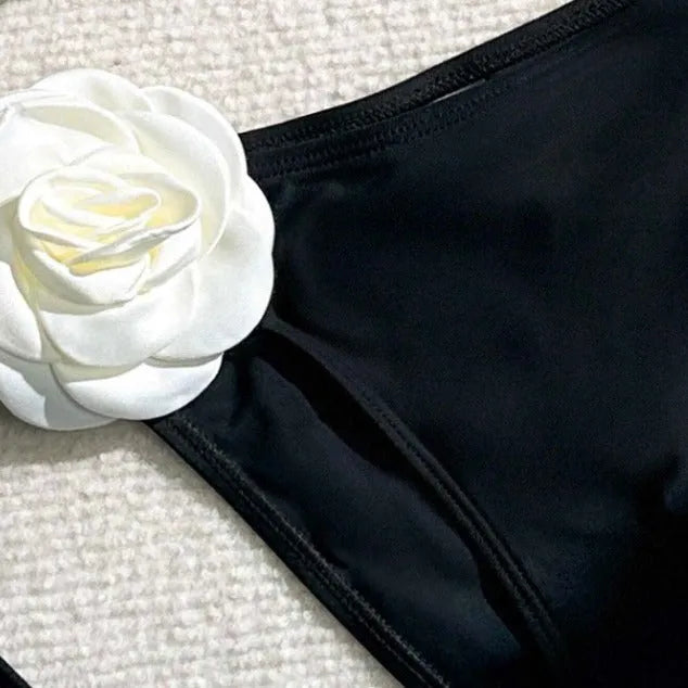 Black women's bikini set with 3D flower lace detailing and an adjustable drawstring waist.