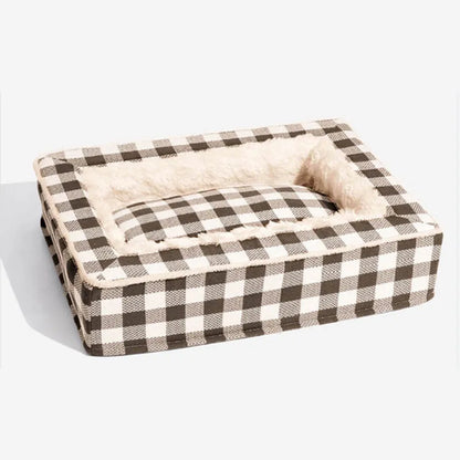 Classic plaid pattern dog kennel with removable cloth cover shown next to a matching cushion