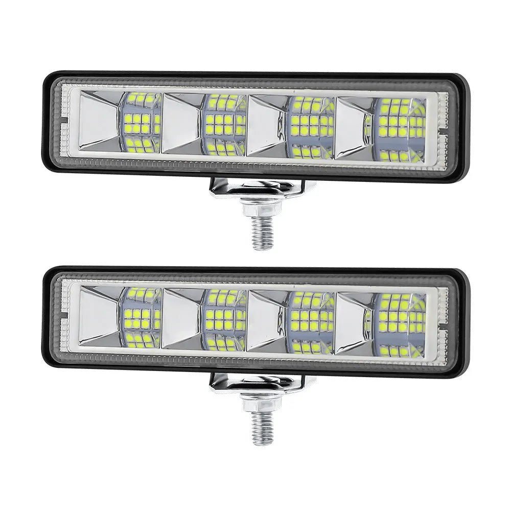 Pack of four rectangular aluminium LED work lights for car and truck modification.