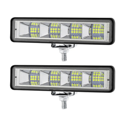 Pack of four rectangular aluminium LED work lights for car and truck modification.