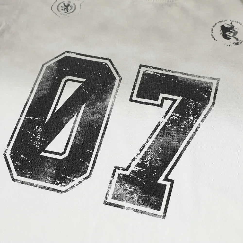 Men's black and white pure cotton short-sleeved printed t-shirt on a hanger.