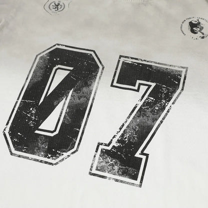 Men's black and white pure cotton short-sleeved printed t-shirt on a hanger.