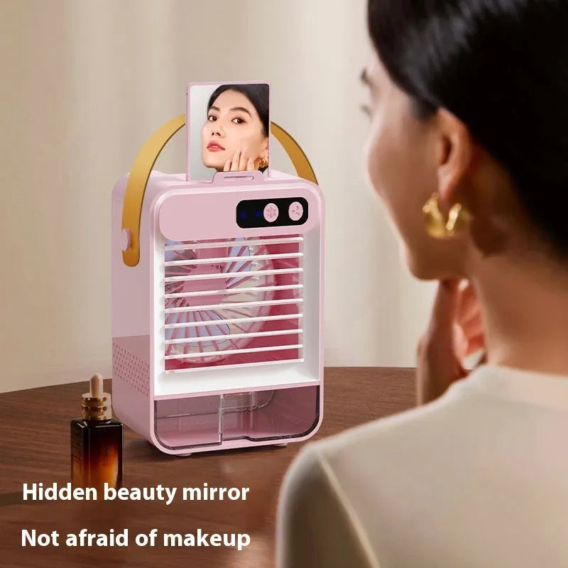 Dark green compact desktop air humidifier with USB port on a wooden desk.