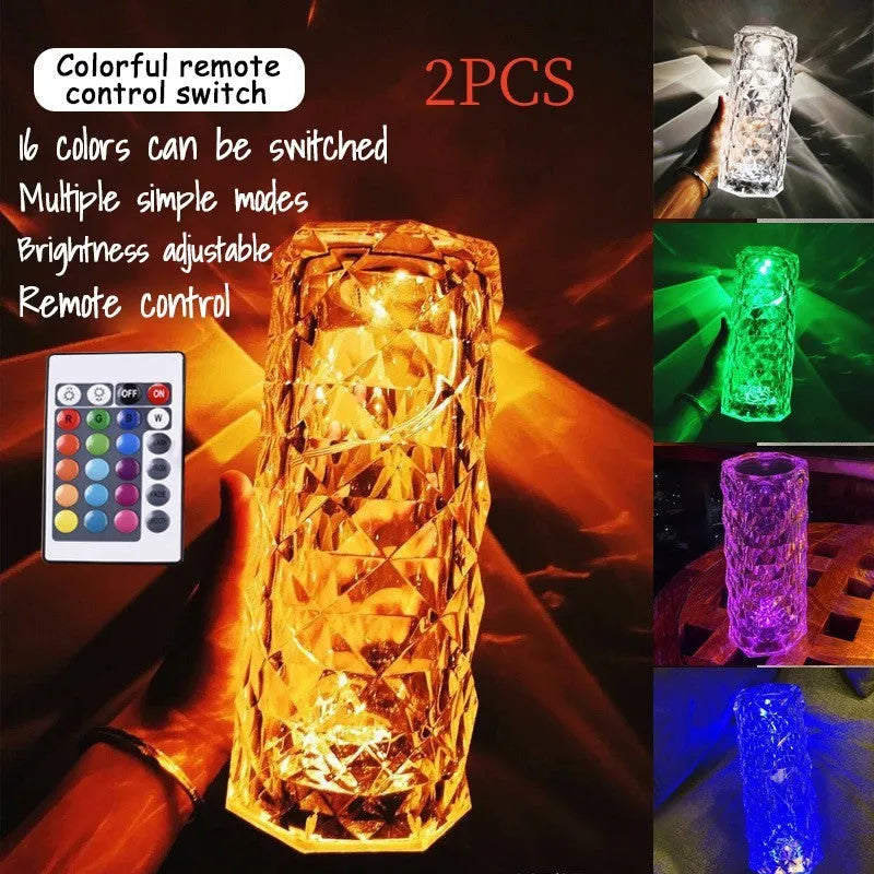 Modern minimalist acrylic crystal rose LED table lamp with touch switch on a wooden table.