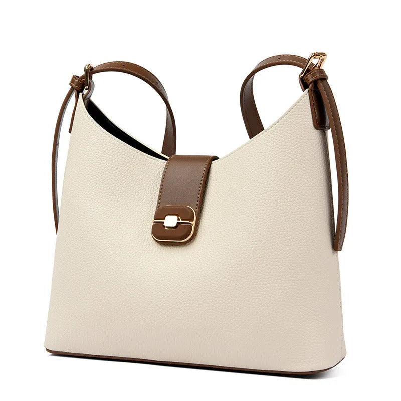 PU bucket shoulder bag in biscuit colour showing internal phone compartment and zippered sections